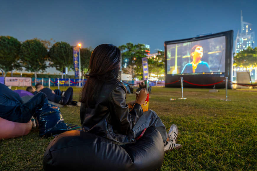 Where to watch out movies in Dubai during winter 2025 Free entry outdoor cinema under the stars at Jumeirah Lake Towers Dubai